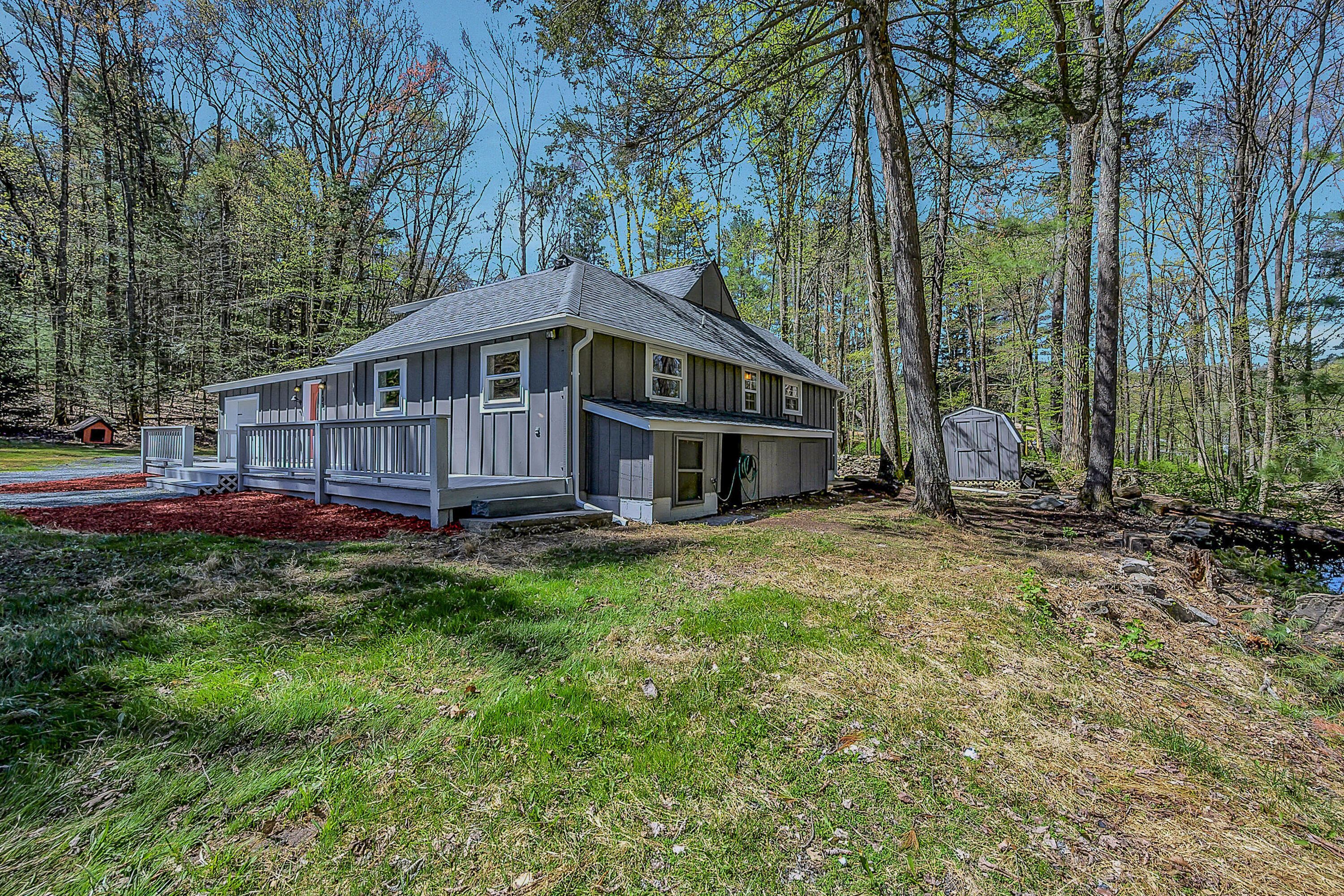 133 Neil Thompson Road Lackawaxen, PA 18425 - Photo 5 of 65 a view of a house with a yard