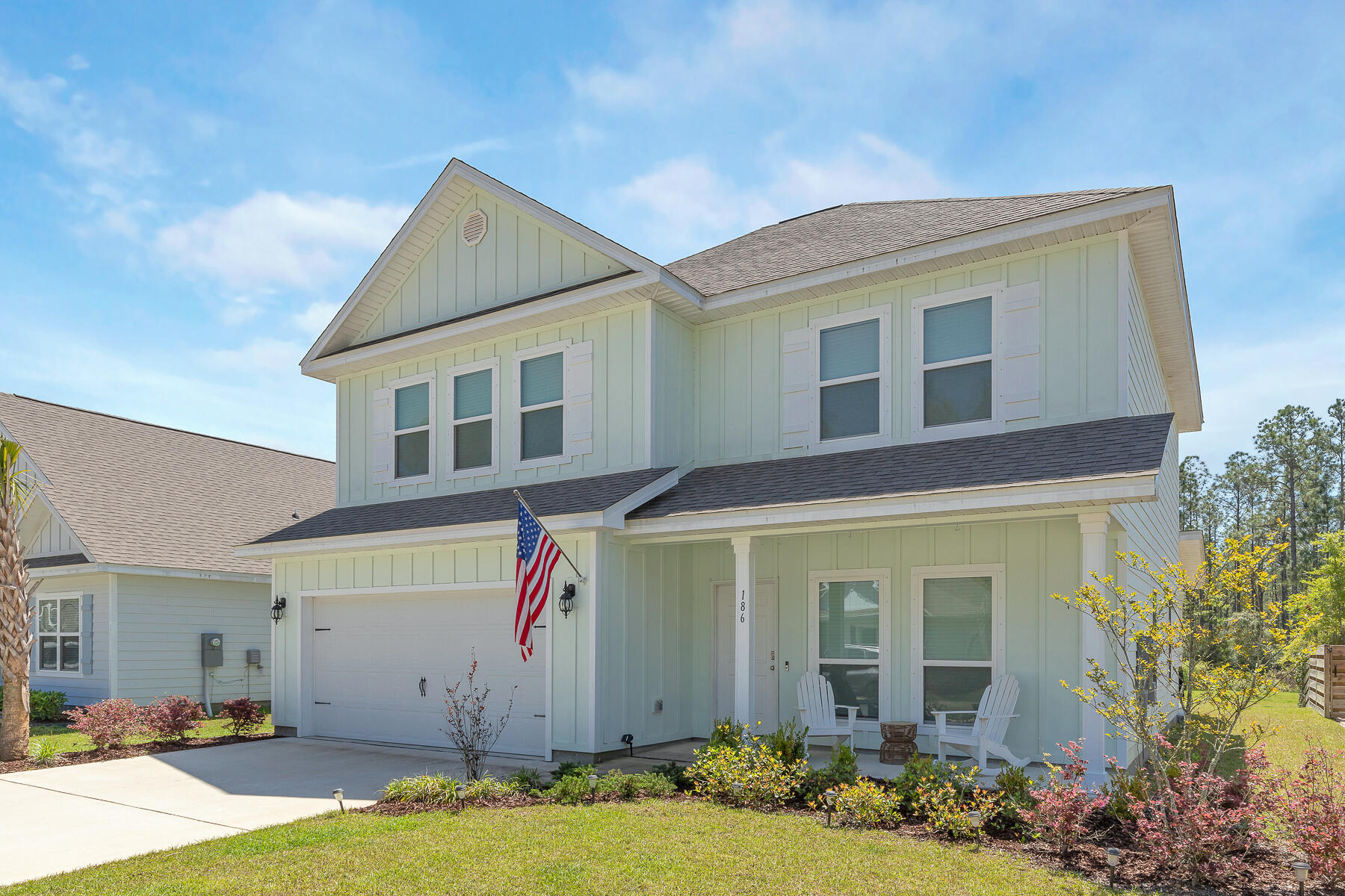 186 Southern Pnes Road Santa Rosa Beach, FL 32459 - Photo 3 of 32 a front view of a house with garden