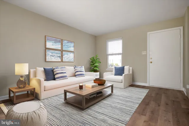 a living room with furniture and a lamp