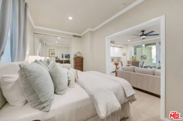 a bed room with a bed and a mirror