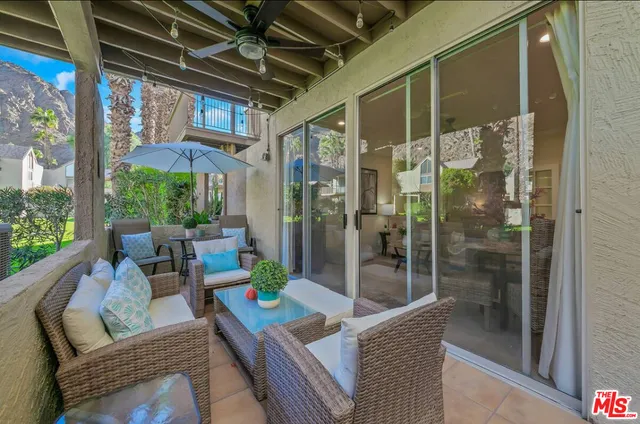 a view of porch with furniture and garden