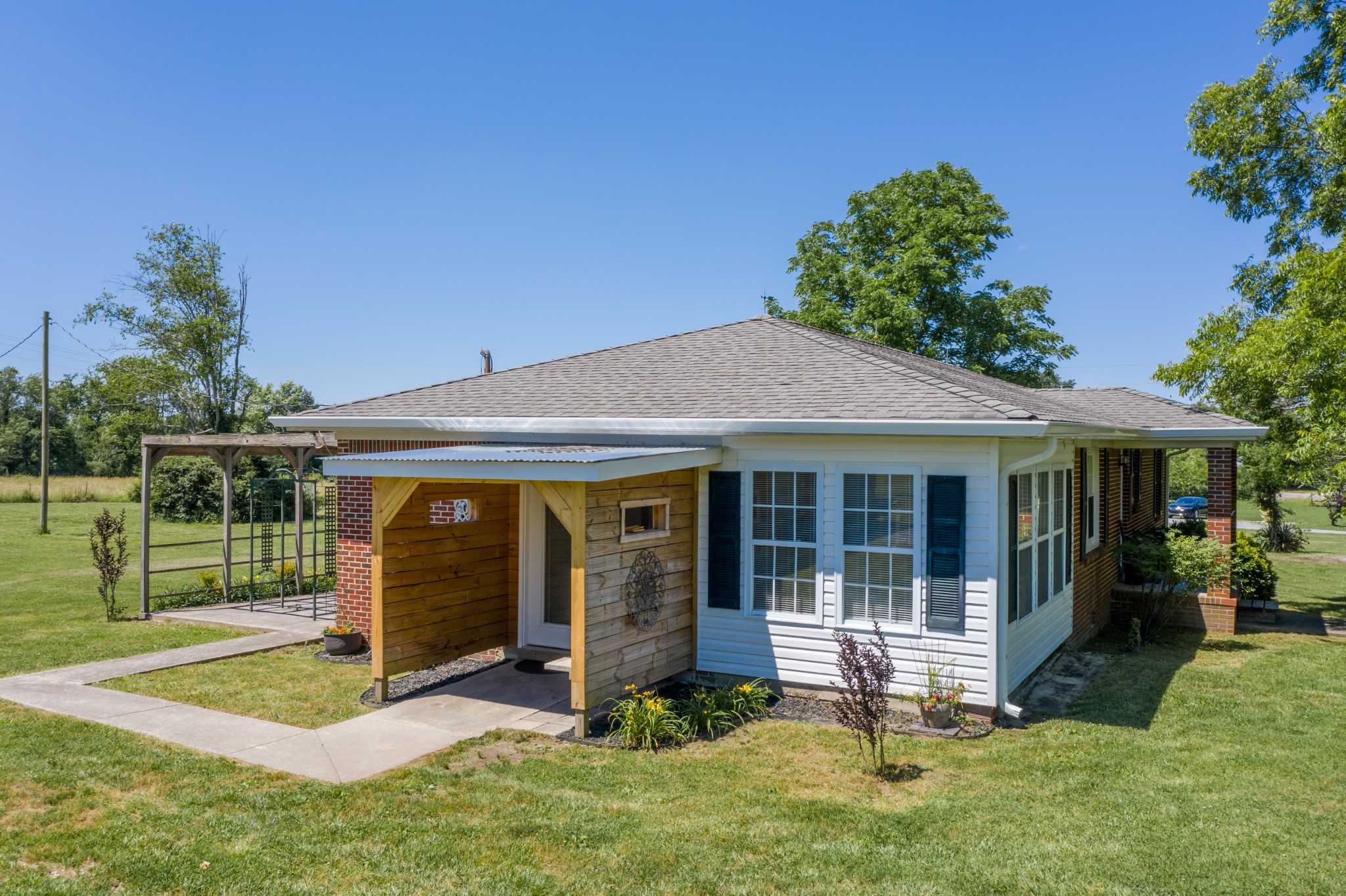 1441 Pleasant View Road Woodbury, TN 37190 - Photo 11 of 32 a view of a house with backyard porch and garden