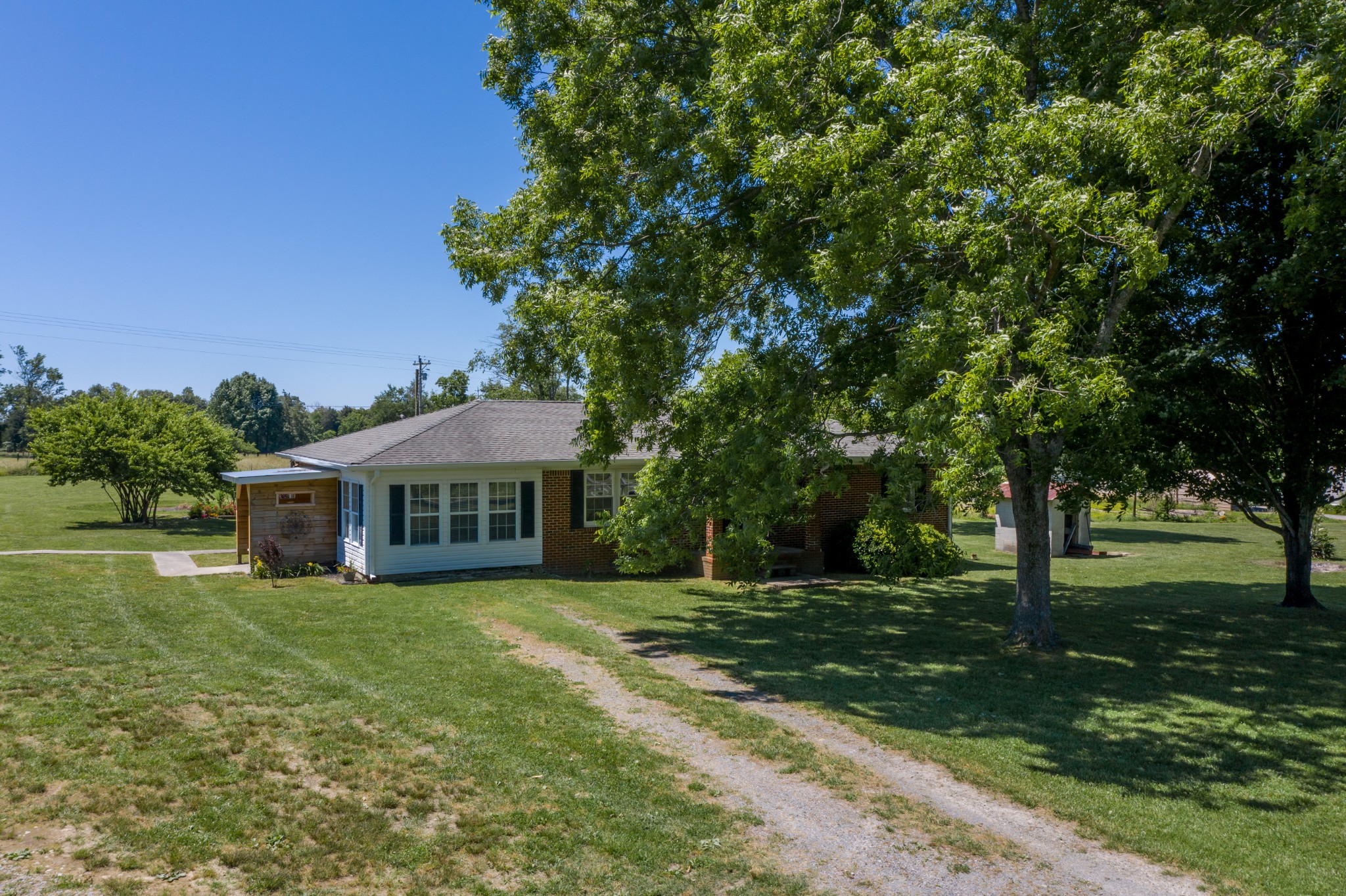 1441 Pleasant View Road Woodbury, TN 37190 - Photo 12 of 32 a view of a house with a big yard