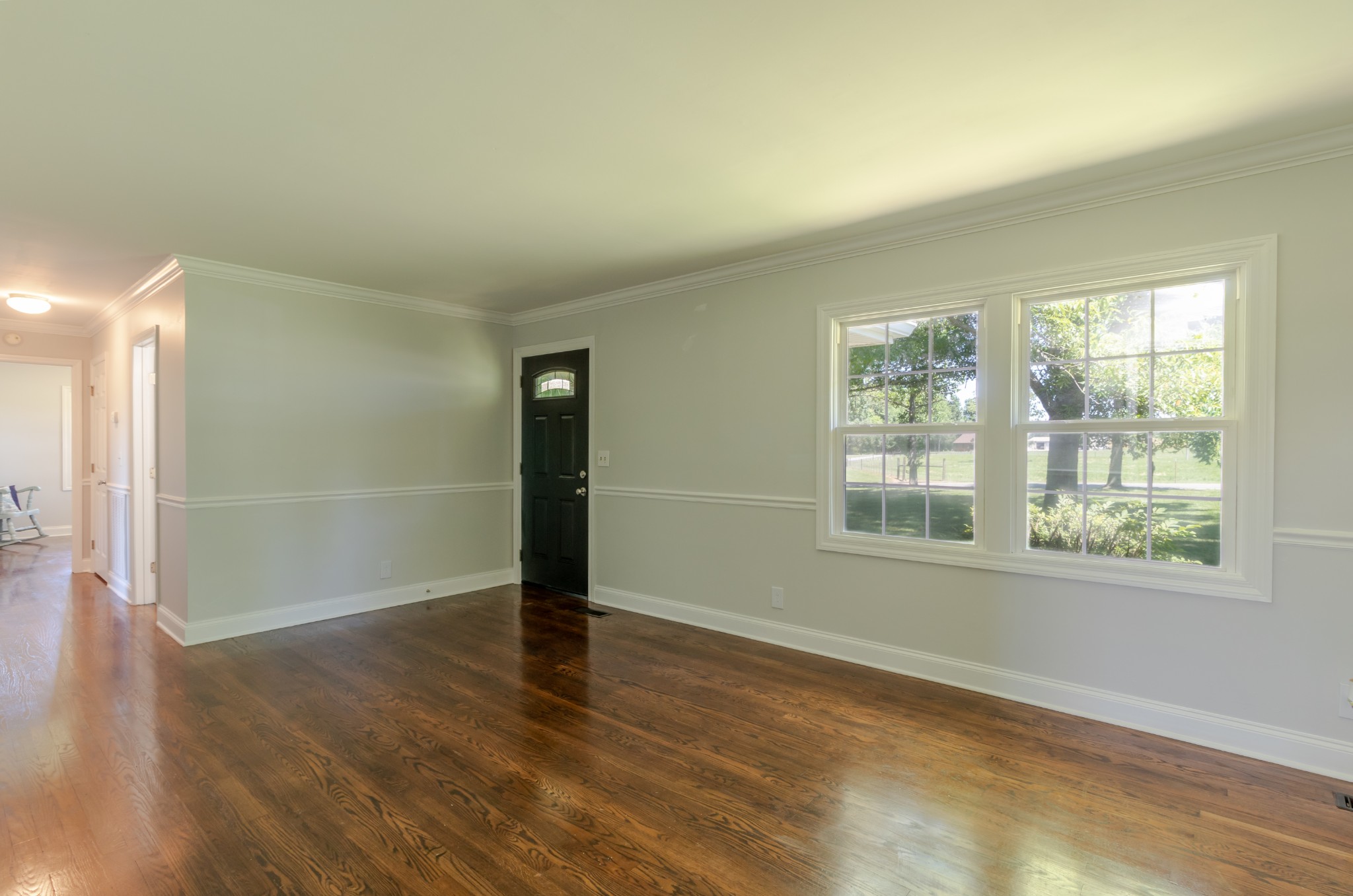 1441 Pleasant View Road Woodbury, TN 37190 - Photo 16 of 32 an empty room with wooden floor and windows