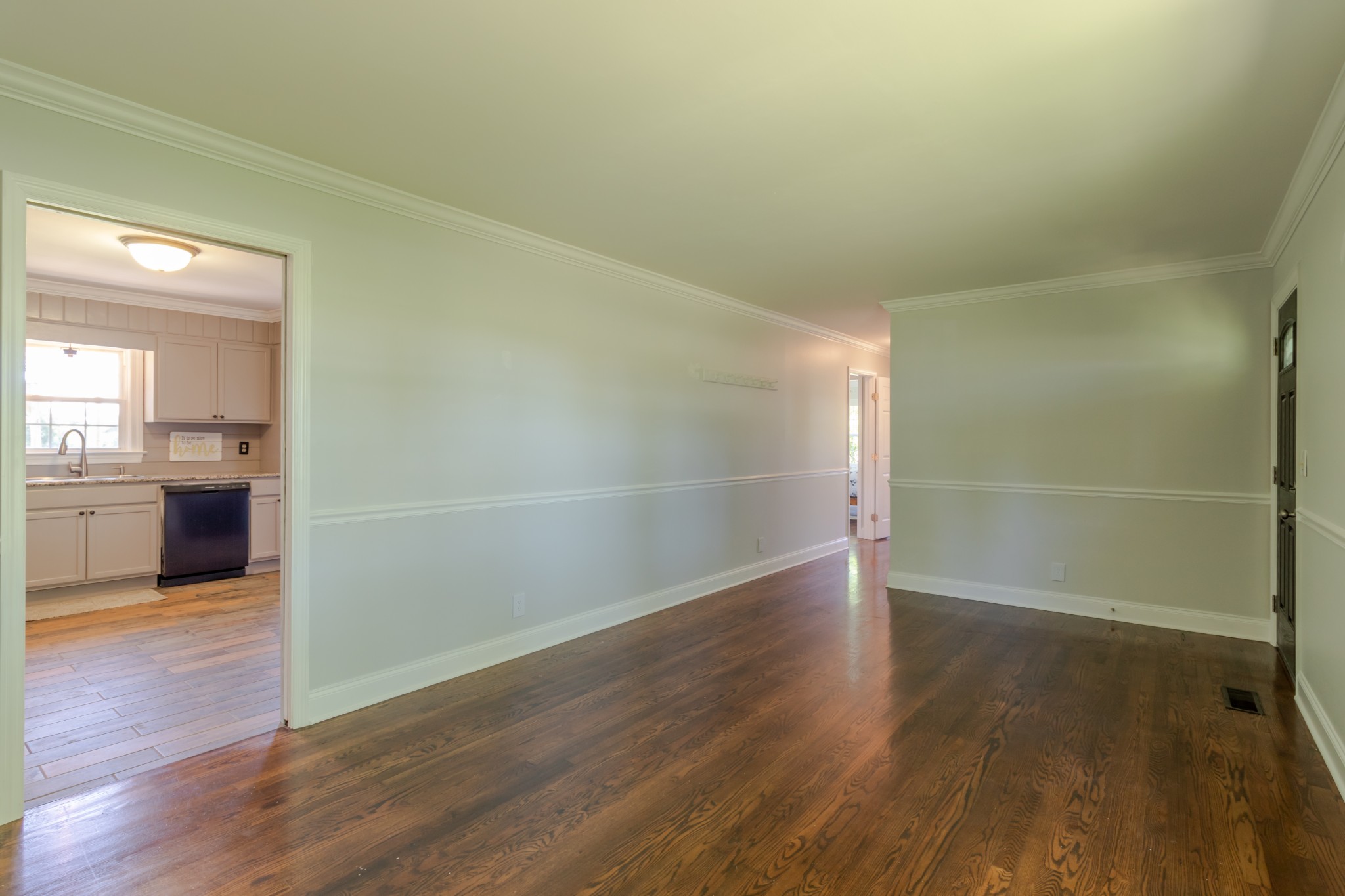 1441 Pleasant View Road Woodbury, TN 37190 - Photo 17 of 32 a view of a room with wooden floor and a kitchen