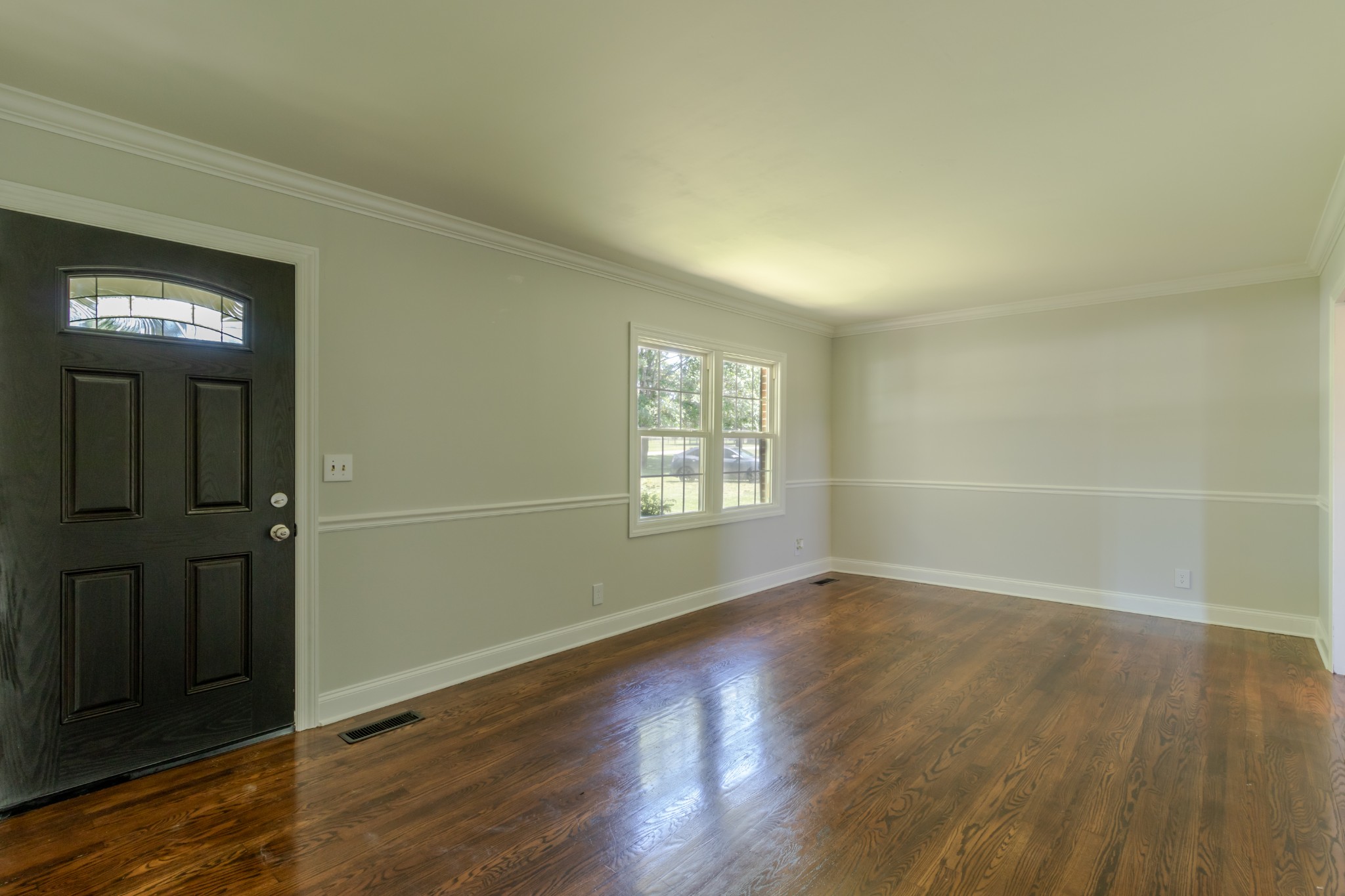 1441 Pleasant View Road Woodbury, TN 37190 - Photo 18 of 32 an empty room with wooden floor and windows