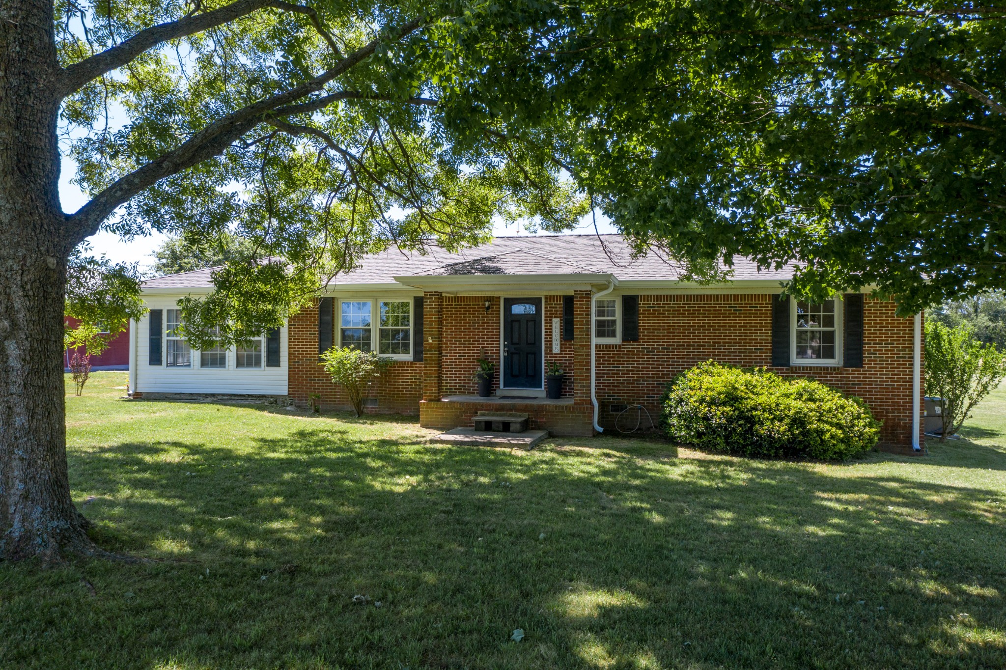 1441 Pleasant View Road Woodbury, TN 37190 - Photo 2 of 32 a front view of a house with garden