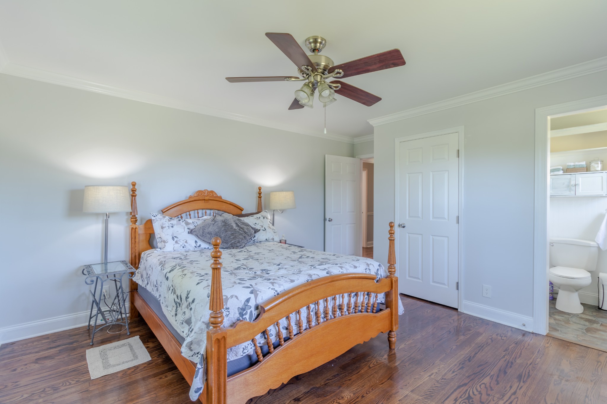 1441 Pleasant View Road Woodbury, TN 37190 - Photo 24 of 32 a bedroom with a bed a dresser and wooden floor