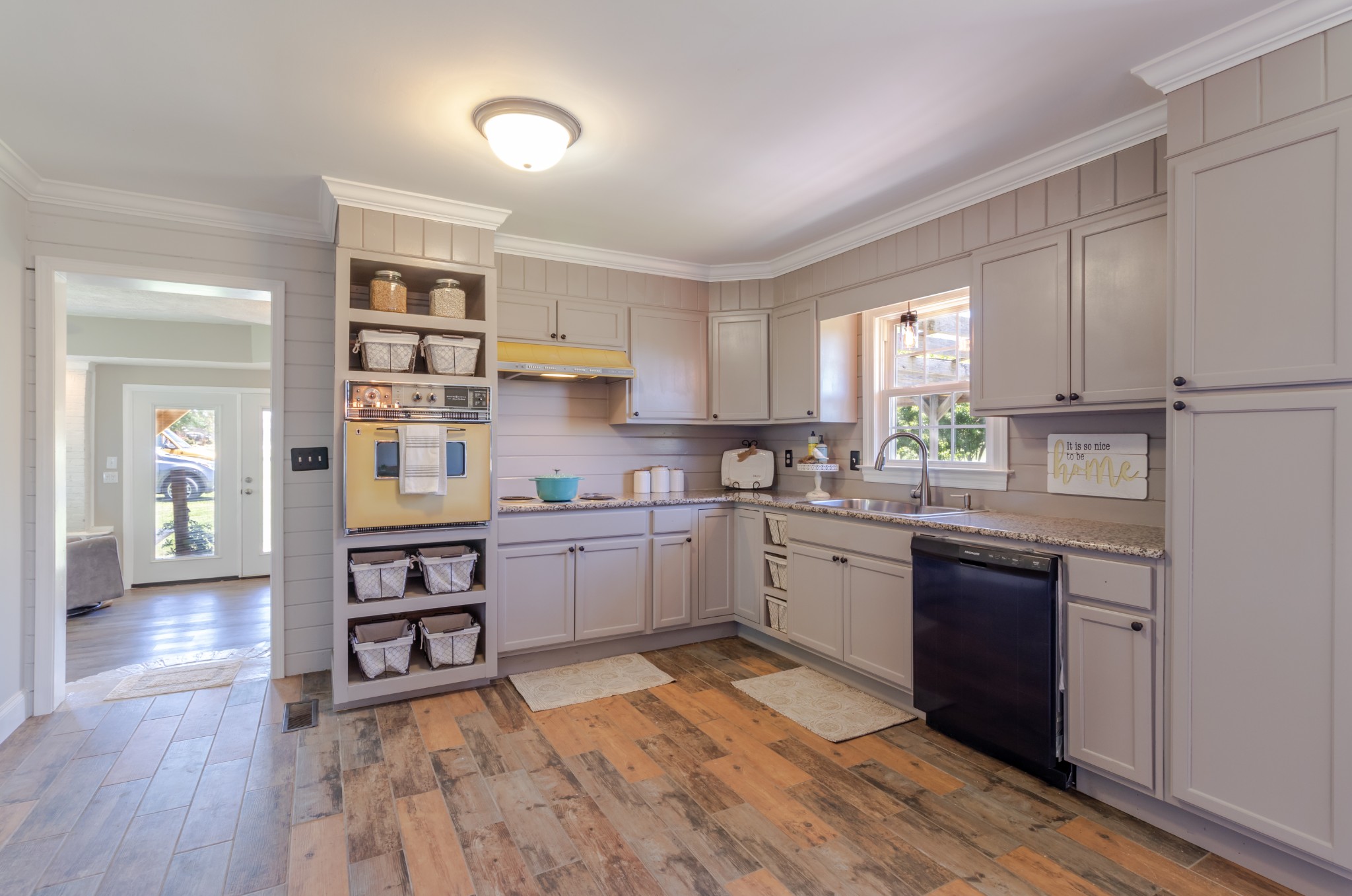 1441 Pleasant View Road Woodbury, TN 37190 - Photo 28 of 32 a kitchen with granite countertop a stove cabinets and wooden floor