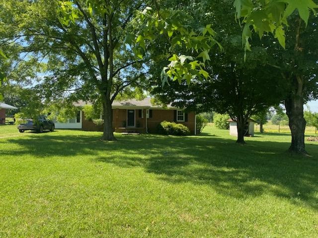 1441 Pleasant View Road Woodbury, TN 37190 - Photo 3 of 32 a front view of a house with garden