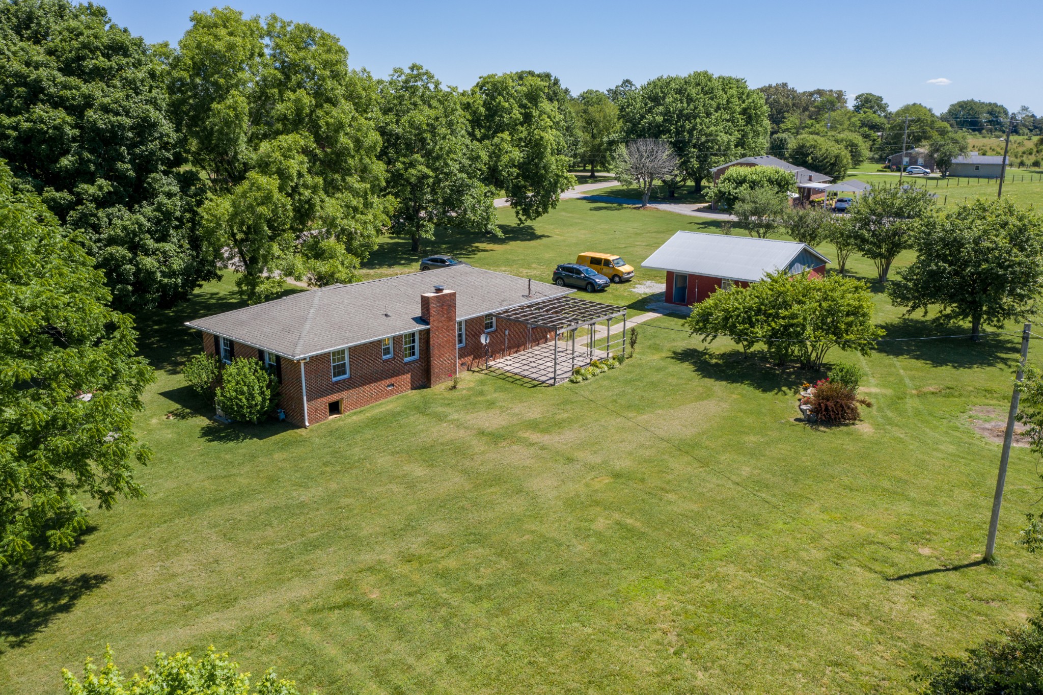 1441 Pleasant View Road Woodbury, TN 37190 - Photo 8 of 32 an aerial view of a house with yard basket ball court and outdoor seating