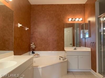 2021 Crestview Way, Unit 113 Naples, FL 34119 - Photo 15 of 24 a bathroom with a sink and a mirror