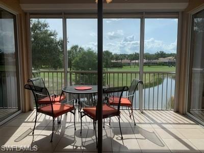 2021 Crestview Way, Unit 113 Naples, FL 34119 - Photo 20 of 24 a view of a balcony with chairs and a potted plant