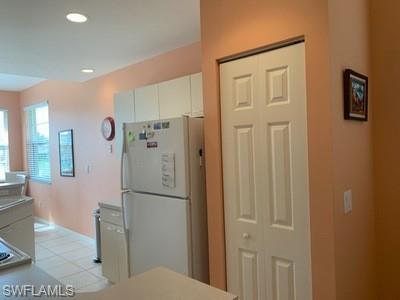 2021 Crestview Way, Unit 113 Naples, FL 34119 - Photo 5 of 24 a bathroom with a glass shower door