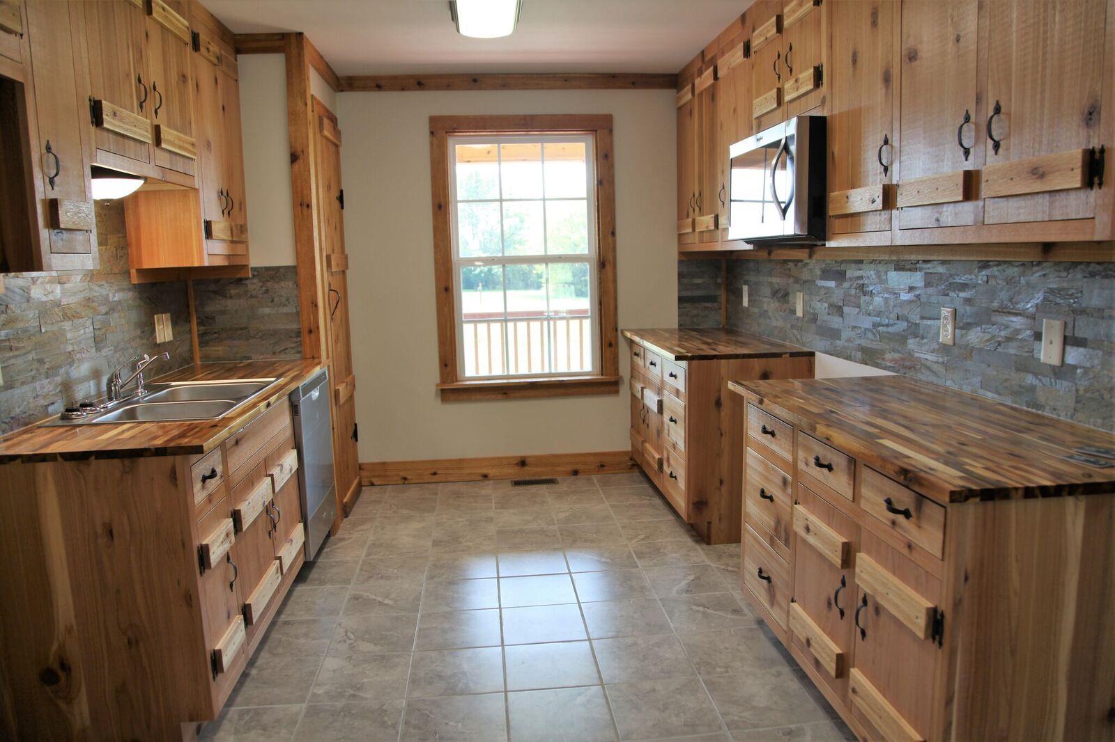 127 Shuab Road Portland, TN 37148 - Photo 7 of 22 Kitchen features cedar cabinets, butcher block countertops and a pantry!