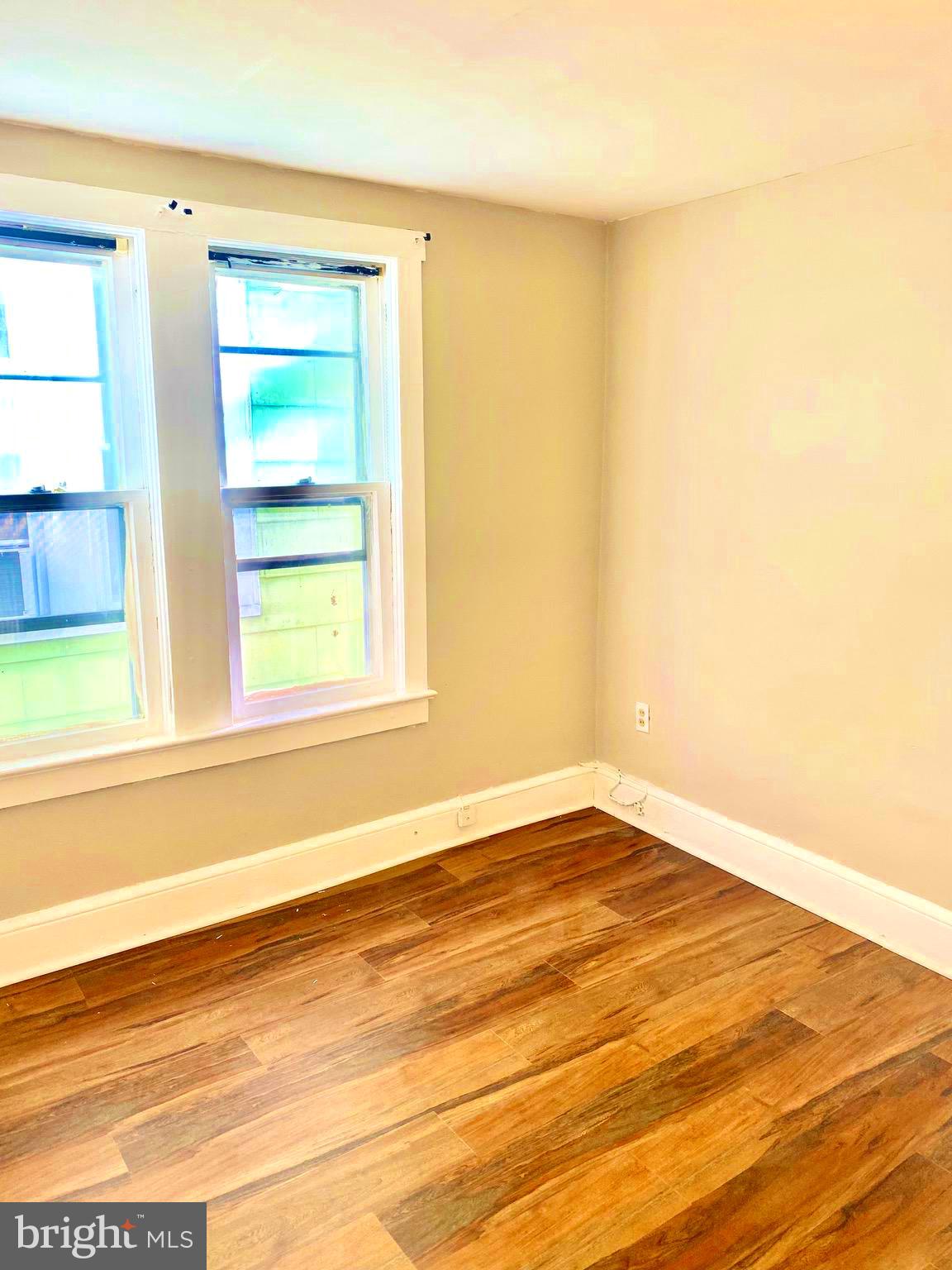 20 Park Lane Hamilton, NJ 08609 - Photo 10 of 12 a view of an empty room with wooden floor and a window
