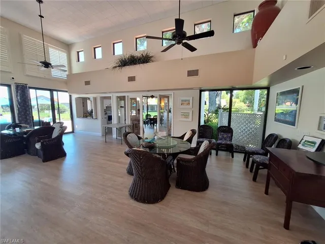a living room with lots of furniture and a chandelier