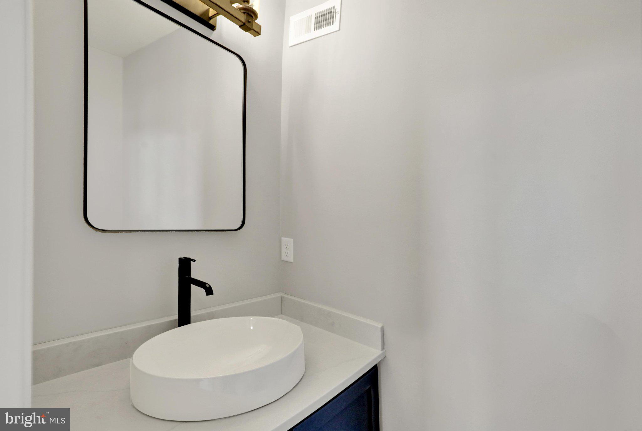 64 Middletown Road Fleetwood, PA 19522 - Photo 26 of 54 a bathroom with a sink and a mirror