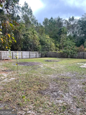 a view of a water fountain and a bench