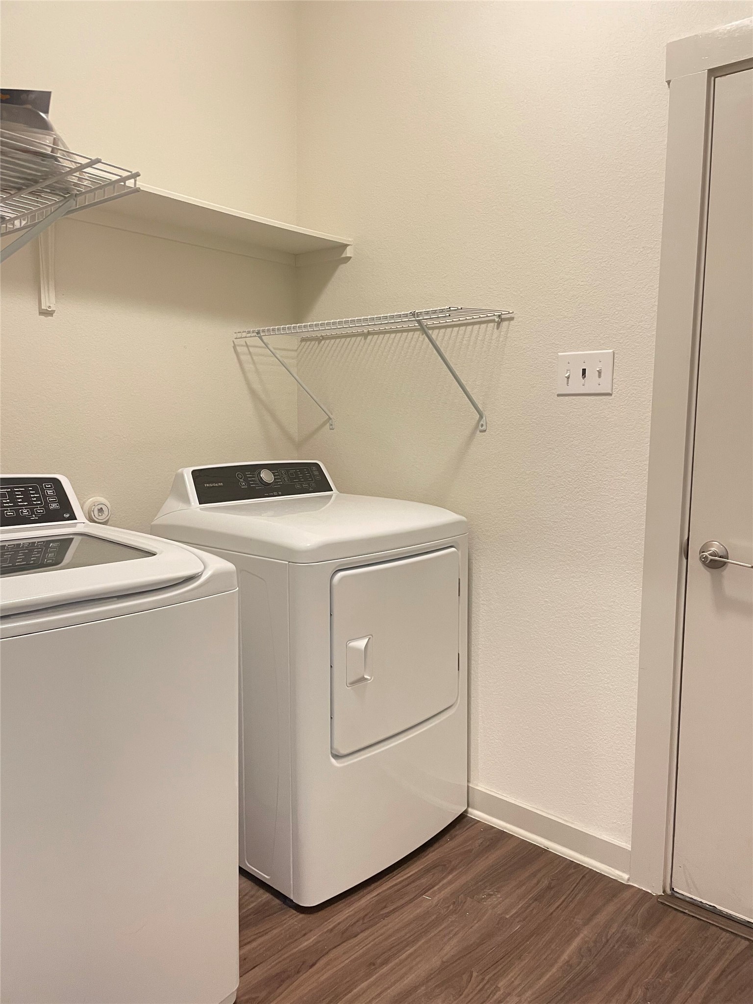 5128 Vanner Path Georgetown, TX 78626 - Photo 17 of 20 Dedicated laundry area featuring wood-finish flooring, a white baseboard, and a white interior door