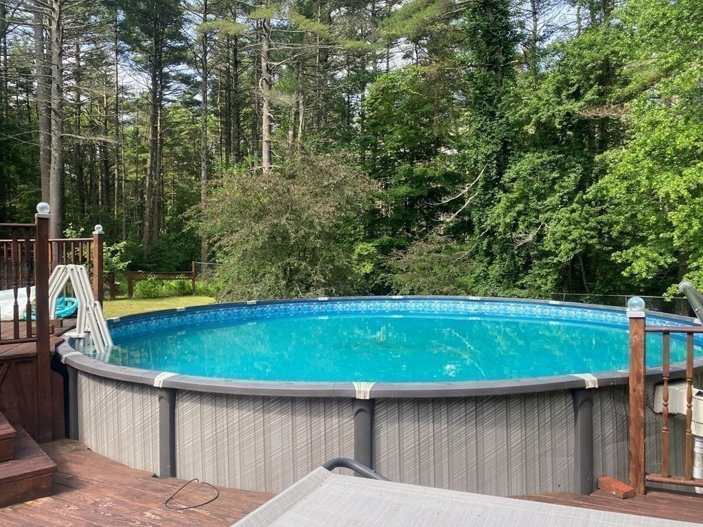 121 River Road Ware, MA 01082 - Photo 11 of 39 a view of a wooden deck with a yard
