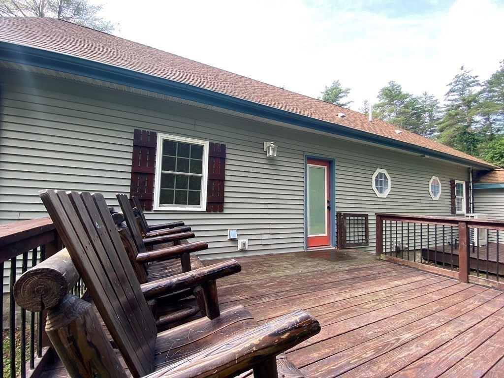 121 River Road Ware, MA 01082 - Photo 14 of 39 a front view of a house with balcony