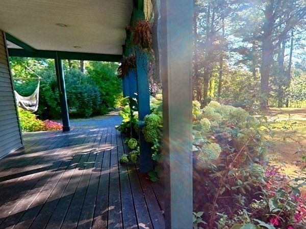 121 River Road Ware, MA 01082 - Photo 15 of 39 a view of a porch with a potted plant