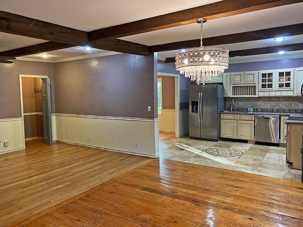 121 River Road Ware, MA 01082 - Photo 19 of 39 a view of a livingroom with a chandelier