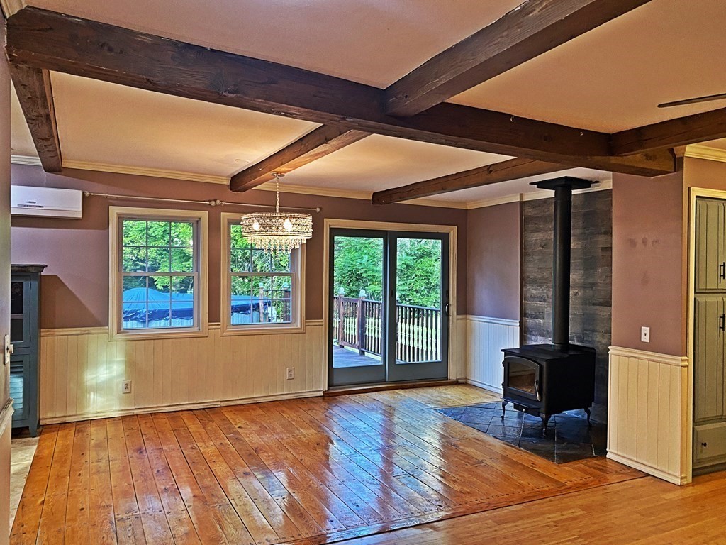 121 River Road Ware, MA 01082 - Photo 21 of 39 a view of an empty room with wooden floor and a window