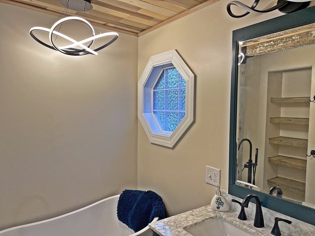 121 River Road Ware, MA 01082 - Photo 33 of 39 a bathroom with a sink and a mirror