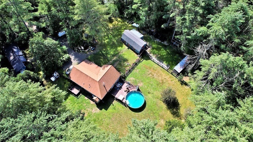 121 River Road Ware, MA 01082 - Photo 38 of 39 an aerial view of a house with a swimming pool a yard and a garden