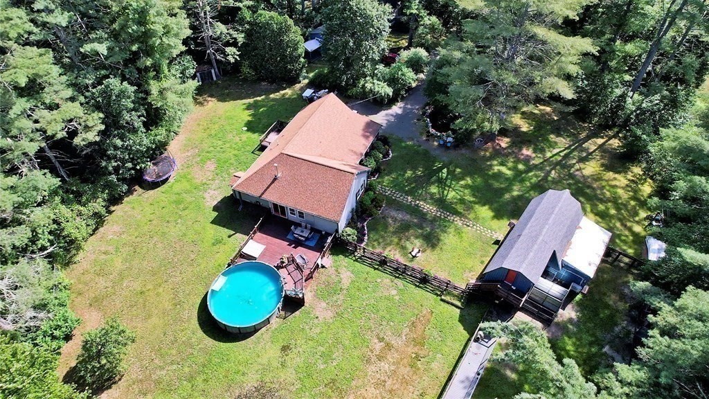 121 River Road Ware, MA 01082 - Photo 5 of 39 an aerial view of a house with swimming pool and garden