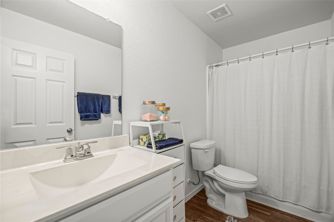 24026 Swather Way Hockley, TX 77447 - Photo 24 of 37 a bathroom with a sink a toilet and a mirror