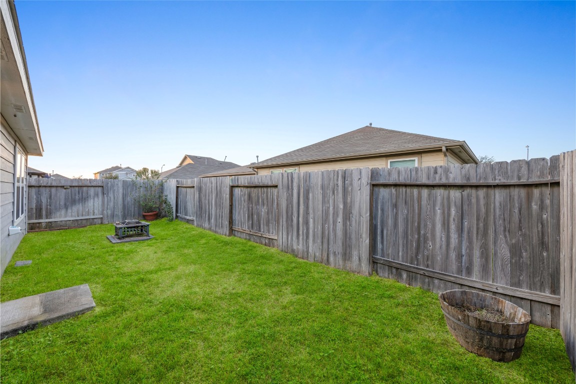 24026 Swather Way Hockley, TX 77447 - Photo 28 of 37 a view of a backyard with wooden fence