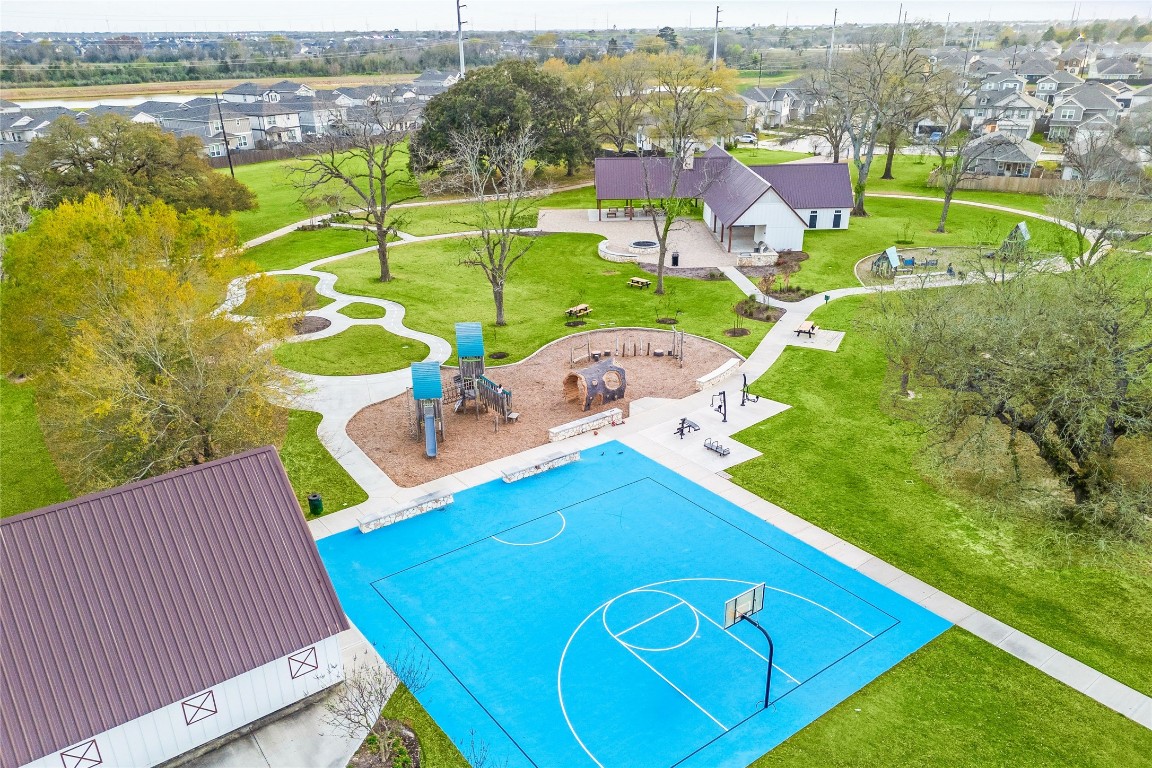 24026 Swather Way Hockley, TX 77447 - Photo 32 of 37 an aerial view of a house with a swimming pool