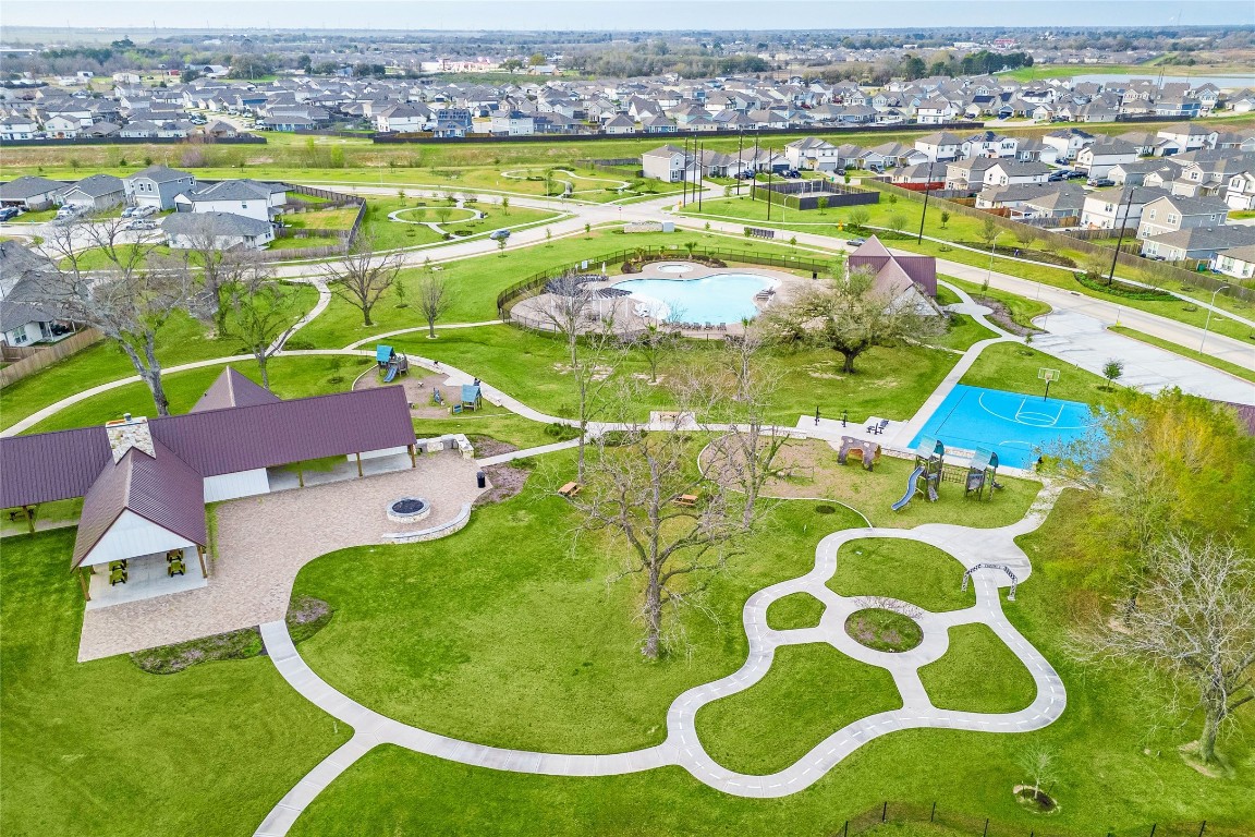 24026 Swather Way Hockley, TX 77447 - Photo 34 of 37 an aerial view of a house with a swimming pool yard and outdoor seating