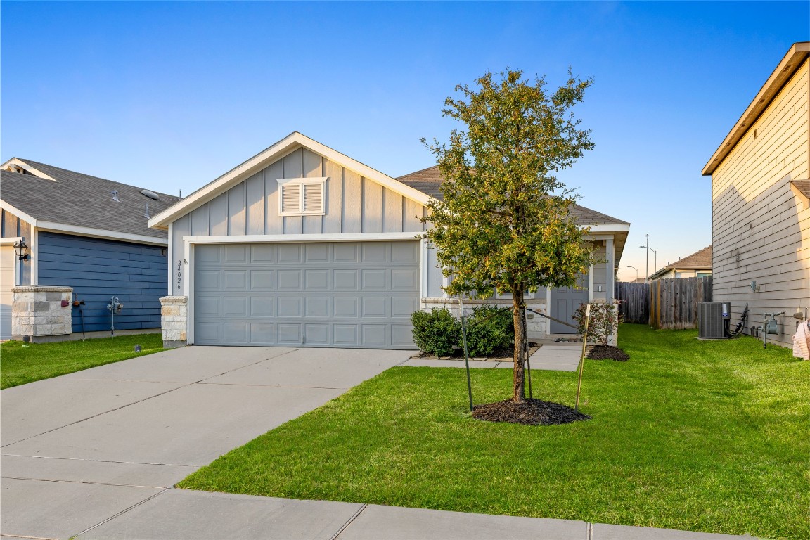 24026 Swather Way Hockley, TX 77447 - Photo 5 of 37 a front view of a house with a yard
