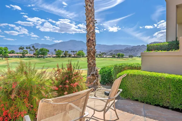 a view of a garden with a patio