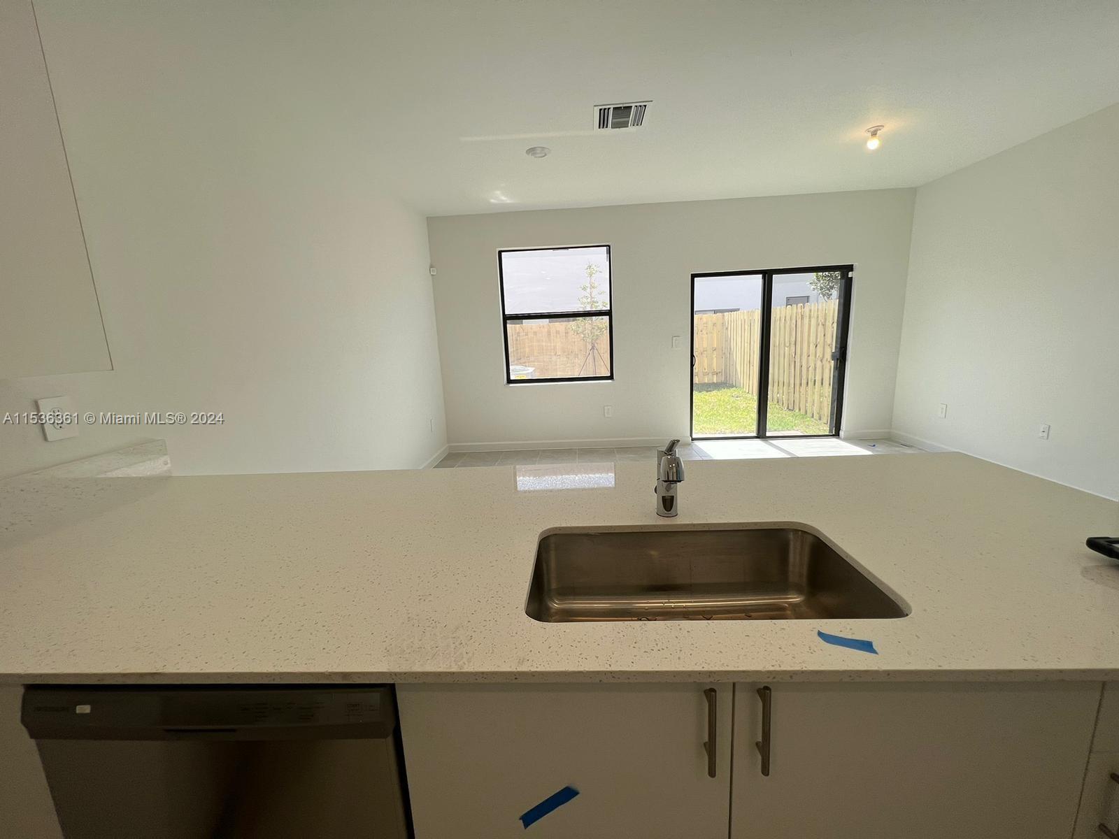 11774 Southwest 246th Street, Unit 11774 Homestead, FL 33032 - Photo 12 of 17 a kitchen with a sink and a window