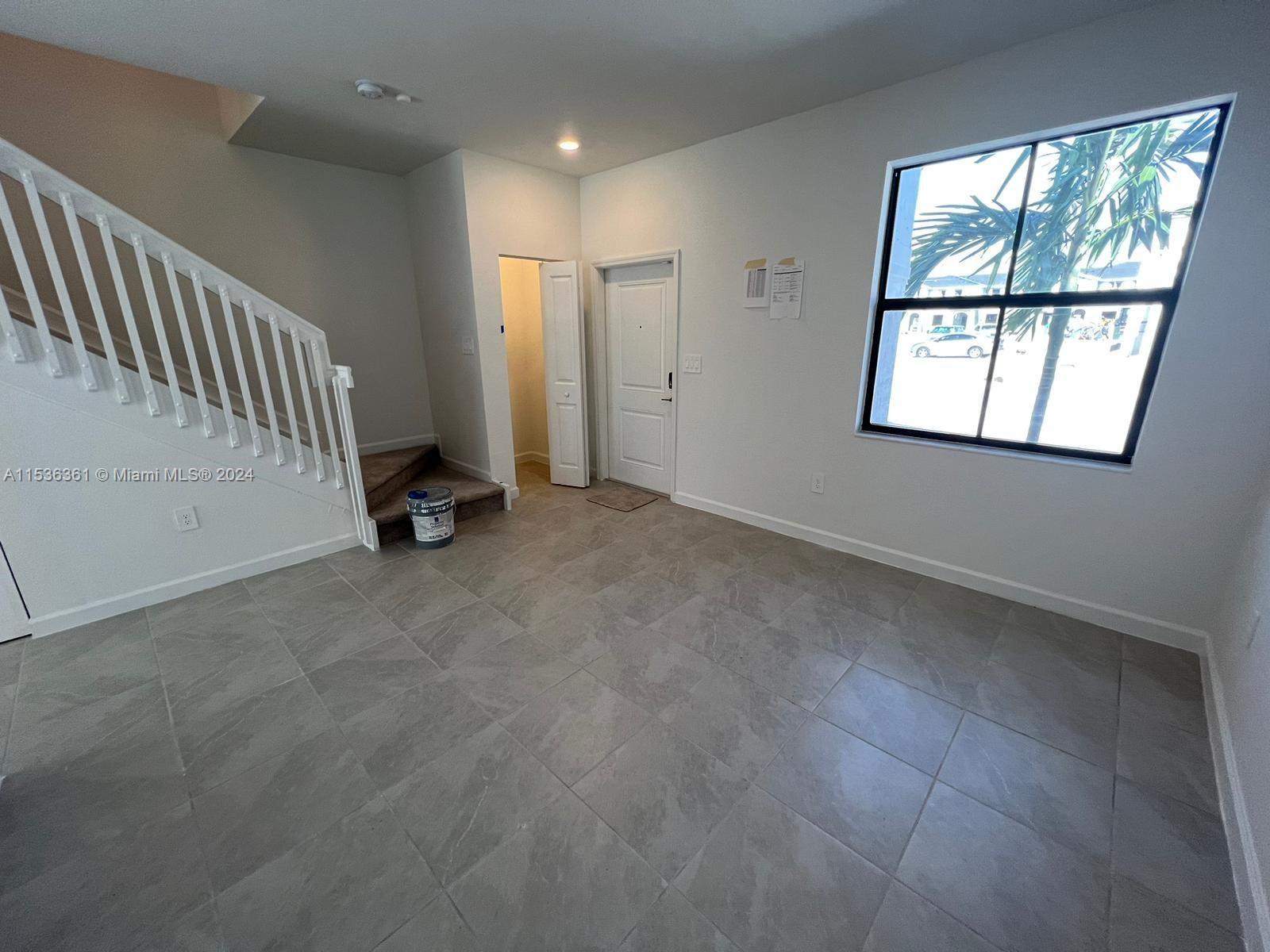 11774 Southwest 246th Street, Unit 11774 Homestead, FL 33032 - Photo 16 of 17 an empty room with windows