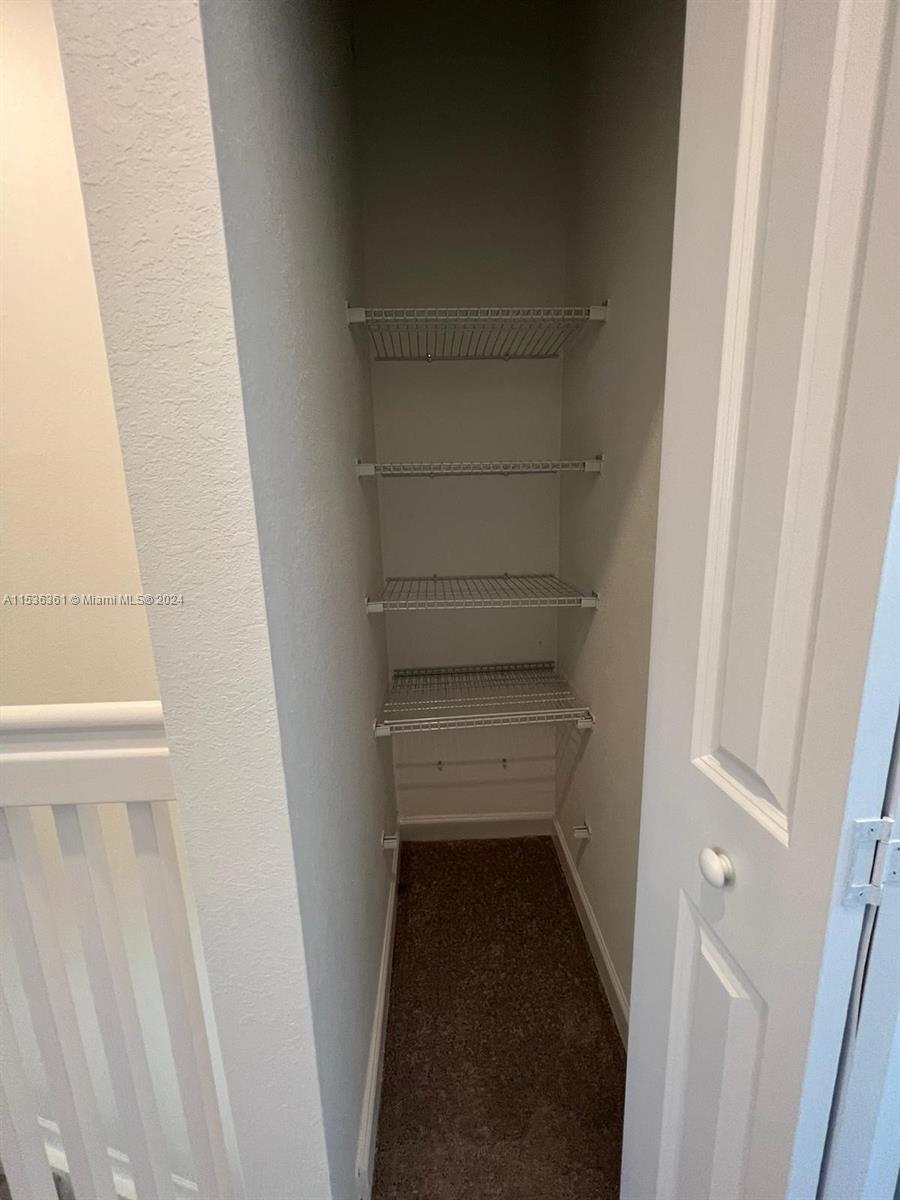 11774 Southwest 246th Street, Unit 11774 Homestead, FL 33032 - Photo 2 of 17 a view of a hallway