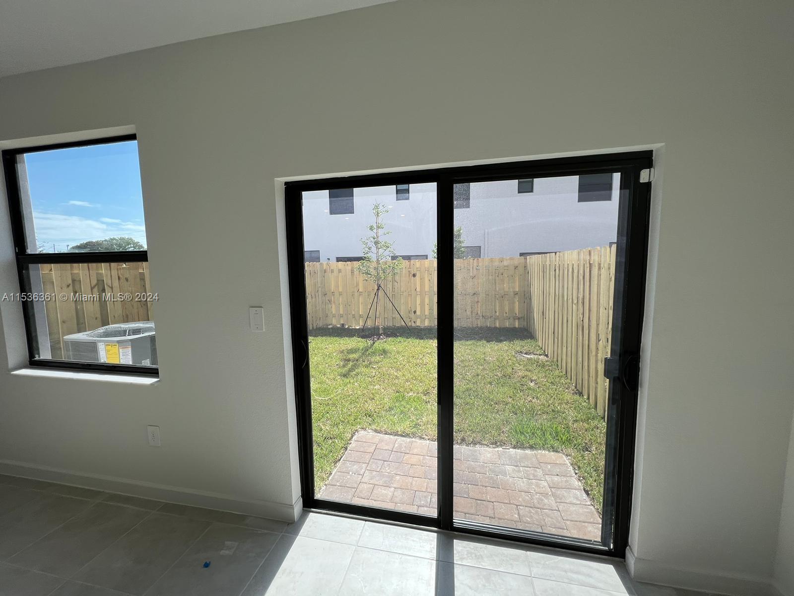 11774 Southwest 246th Street, Unit 11774 Homestead, FL 33032 - Photo 10 of 17 a view of a porch