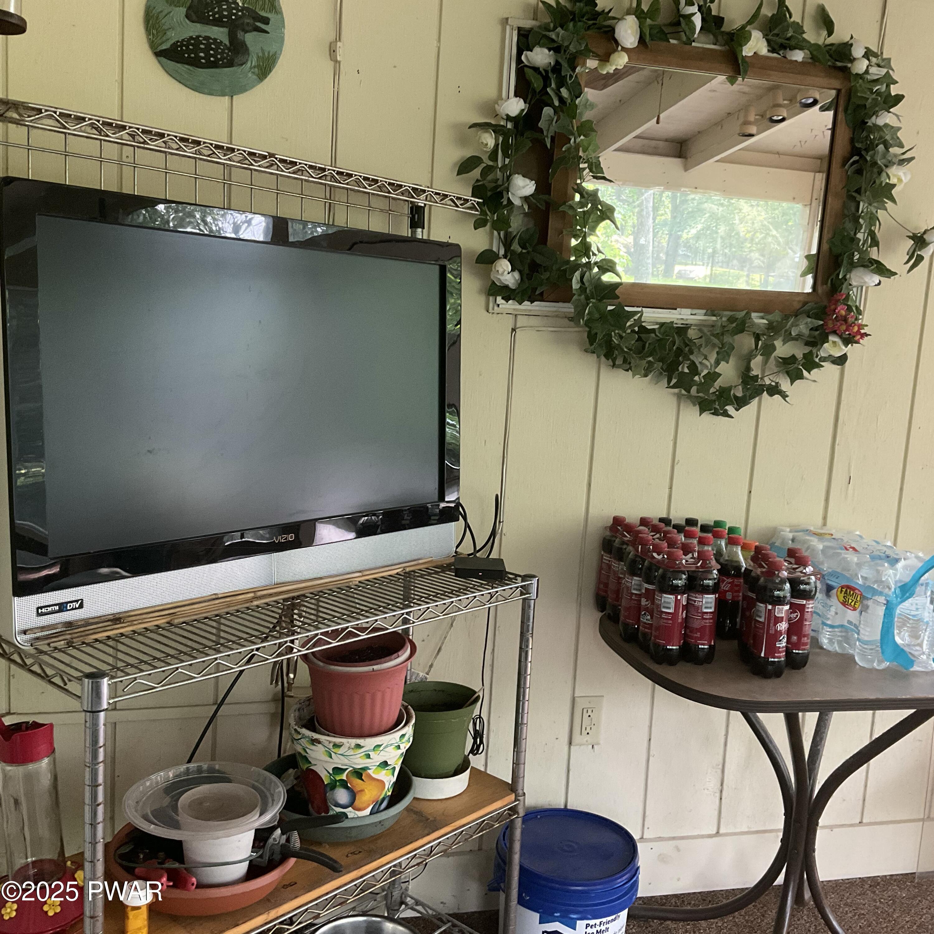 124 Roundhill Road Dingmans Ferry, PA 18328 - Photo 20 of 47 a room with a washing machine and a chair