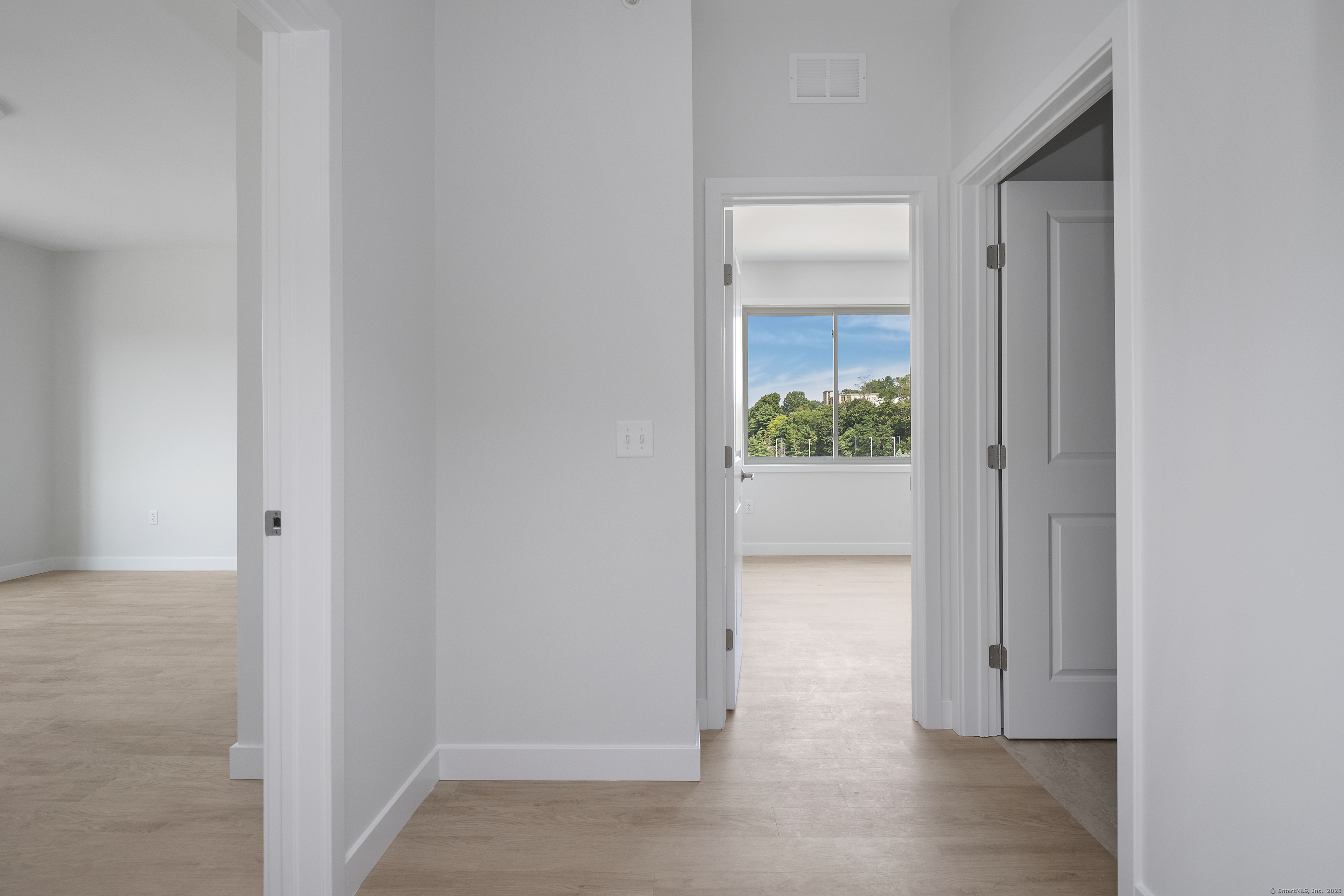 100 North Main Street, Unit 412 Bristol, CT 06010 - Photo 4 of 11 a view of a hallway with wooden floor