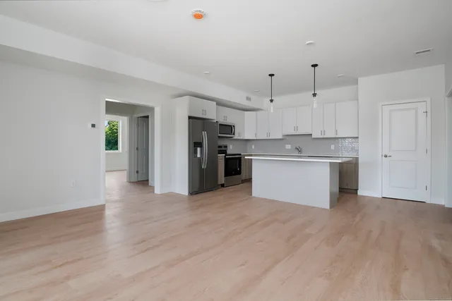 a view of kitchen with wooden floor