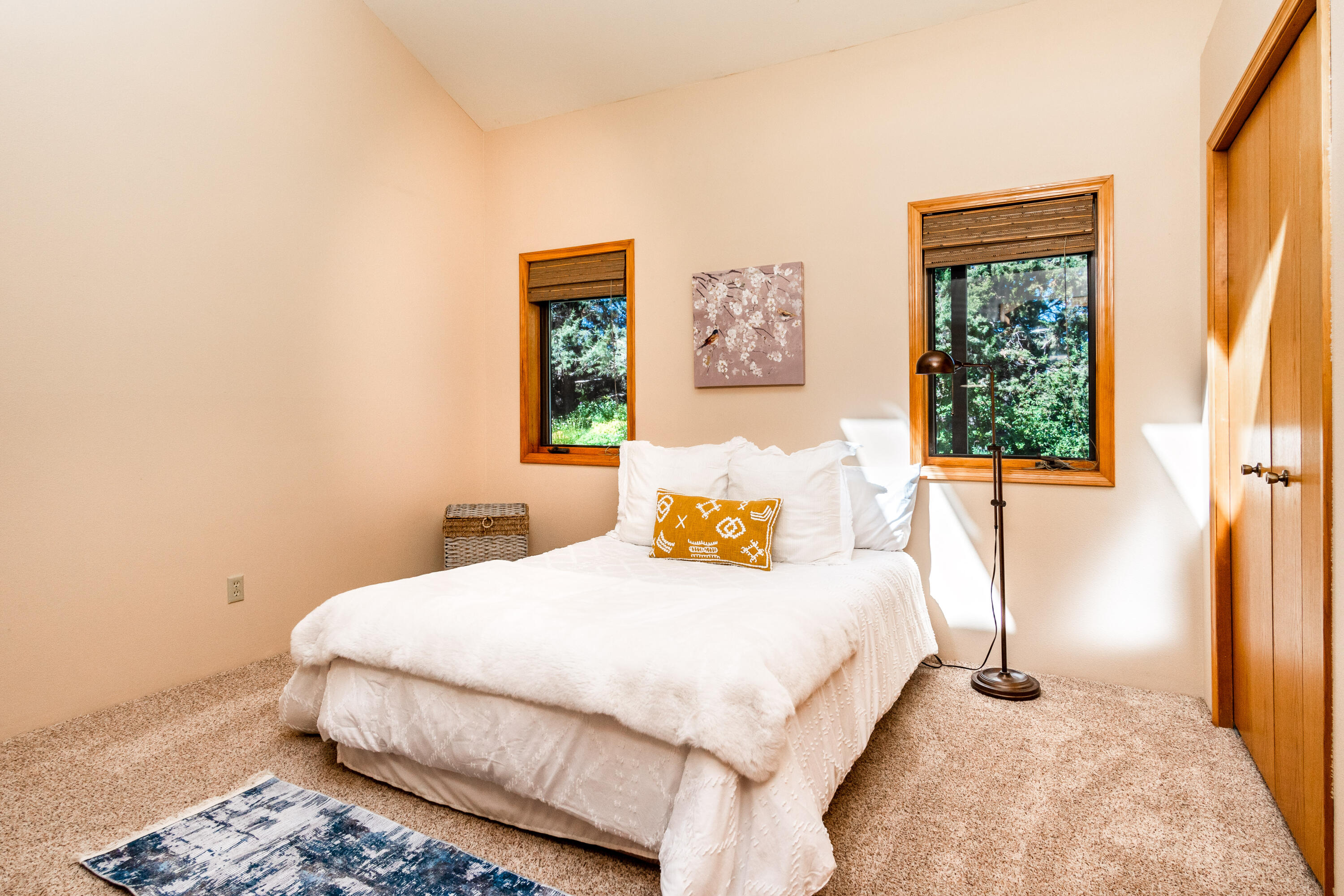 63536 Vogt Road Bend, OR 97701 - Photo 17 of 44 a bedroom with a bed and a window