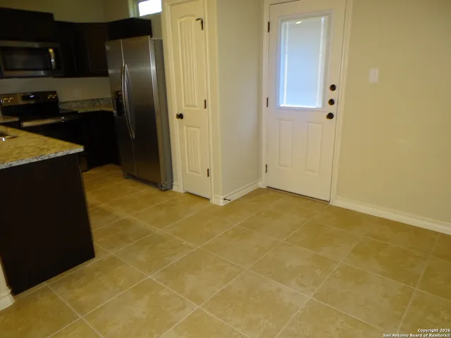 a view of a kitchen with a sink