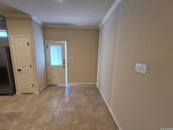an empty room with a mirror