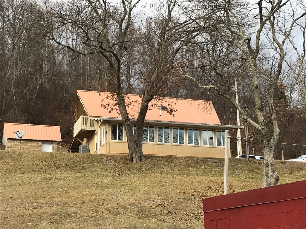 732 Pumice Road Clendenin, WV 25045 - Photo 7 of 30 Cottage is perched above the barn & pond.