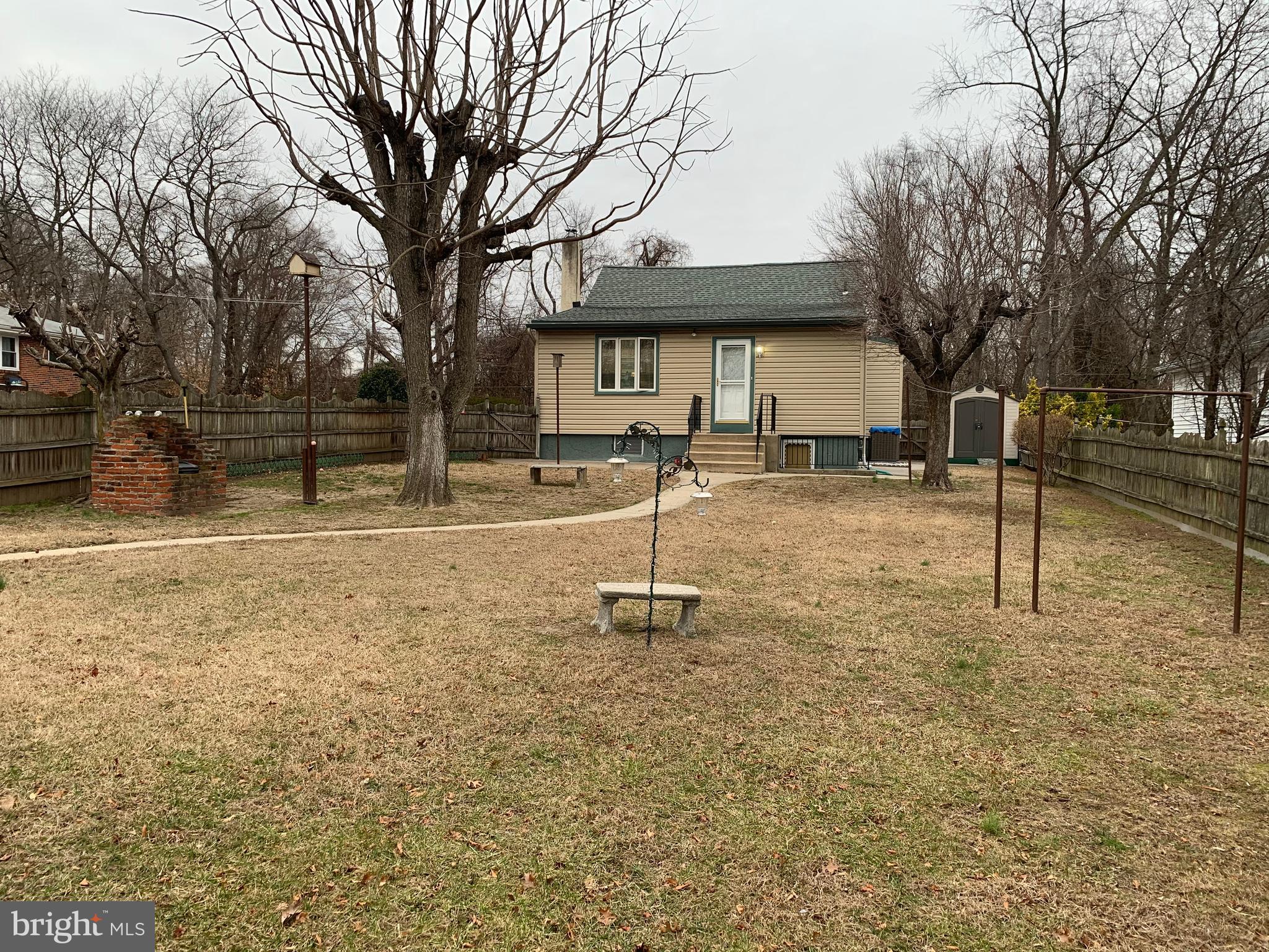 1052 Almonesson Road Westville, NJ 08093 - Photo 16 of 17 a backyard of a house with table and chairs